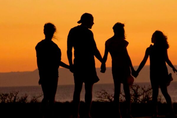family walking beach